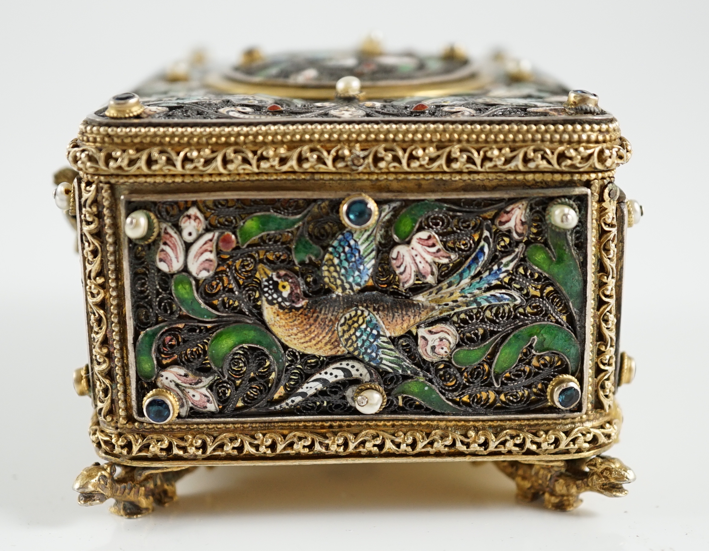 A 19th century Austro-Hungarian 800 standard silver gilt, jewelled and enamelled rectangular singing bird box automaton